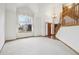 Inviting foyer features hardwood floors, high ceilings, grand staircase, and large picturesque windows at 2247 Eagles Nest Dr, Lafayette, CO 80026