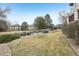 Beautiful lawn with mature trees and manicured shrubbery at 2247 Eagles Nest Dr, Lafayette, CO 80026