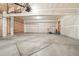 Spacious two-car garage with exposed framing and concrete floor at 2247 Eagles Nest Dr, Lafayette, CO 80026