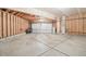 Spacious two-car garage with exposed framing and concrete floor at 2247 Eagles Nest Dr, Lafayette, CO 80026
