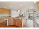 Spacious kitchen with island cooktop and hardwood floors at 2247 Eagles Nest Dr, Lafayette, CO 80026