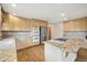 Kitchen with granite counters, stainless appliances, hardwood floors, and eat-in dining at 2247 Eagles Nest Dr, Lafayette, CO 80026