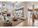 Spacious living room features a fireplace, vaulted ceilings, many windows, and hardwood floors at 2247 Eagles Nest Dr, Lafayette, CO 80026