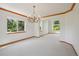 Inviting space featuring abundant natural light, neutral walls, and archways at 2247 Eagles Nest Dr, Lafayette, CO 80026