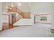 Open-concept room featuring hardwood floors, a staircase, and ample natural light at 2247 Eagles Nest Dr, Lafayette, CO 80026