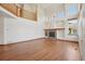 Spacious living room featuring a fireplace, hardwood floors, built-in shelves, and lots of natural light at 2247 Eagles Nest Dr, Lafayette, CO 80026