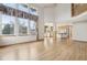 Spacious living room featuring an open floor plan, hardwood floors, and soaring ceilings at 2247 Eagles Nest Dr, Lafayette, CO 80026