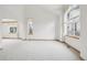 Bright living room features neutral carpet and picturesque windows providing lots of natural light at 2247 Eagles Nest Dr, Lafayette, CO 80026