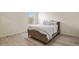 Comfortable bedroom with a decorative wall art and lots of natural light at 309 Spruce St, Bennett, CO 80102