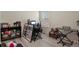 A bedroom featuring wood floors, desk area, and a sunlit window at 309 Spruce St, Bennett, CO 80102