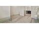 Bright living space shows natural light from the large window, with adjacent kitchen and dining spaces at 309 Spruce St, Bennett, CO 80102
