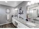 Spacious bathroom with double sinks, plenty of counter space and a large mirror at 256 Ash St, Bennett, CO 80102