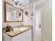 Bathroom showcasing granite countertops, modern vanity, and updated fixtures at 3022 S Wheeling Way # 107, Aurora, CO 80014