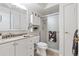 Bathroom features a white vanity and a shower with glass doors at 3022 S Wheeling Way # 107, Aurora, CO 80014