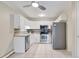 Kitchen featuring stainless steel appliances and white cabinetry at 3022 S Wheeling Way # 107, Aurora, CO 80014