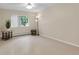 Bright living room with modern lighting, neutral walls, and a view from the window at 3022 S Wheeling Way # 107, Aurora, CO 80014