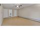 Inviting living room, featuring two closets for extra storage and a ceiling fan at 3022 S Wheeling Way # 107, Aurora, CO 80014