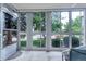 Enclosed patio providing serene view of the surrounding trees and greenery at 3022 S Wheeling Way # 107, Aurora, CO 80014