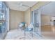 Enclosed patio area with tile flooring, ceiling fan, and sliding glass doors at 3022 S Wheeling Way # 107, Aurora, CO 80014