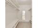 Clean, open walk-in closet features shelving to keep you organized at 3022 S Wheeling Way # 107, Aurora, CO 80014