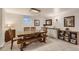 Dining room with seating for eight, a wet bar, and neutral walls and flooring at 13 Club Ln, Littleton, CO 80123