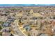 A high angle shows the backyard, along with a view of the neighborhood and mountains in the distance at 5051 Yates Cir, Broomfield, CO 80020