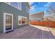 Spacious wood deck is featured outside this home, creating a cozy outdoor living space at 5051 Yates Cir, Broomfield, CO 80020