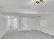 Finished basement with neutral carpet and access to a utility room, offering versatile space at 5051 Yates Cir, Broomfield, CO 80020