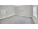 Finished basement with neutral carpet and a window for natural light, perfect for recreation or storage at 5051 Yates Cir, Broomfield, CO 80020
