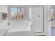 Bright bathroom featuring a soaking tub, glass shower, and tile surround at 5051 Yates Cir, Broomfield, CO 80020