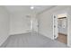 Neutral bedroom with vaulted ceiling, carpet, and ensuite bathroom access at 5051 Yates Cir, Broomfield, CO 80020