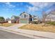 A charming two-story home with a two-car garage, and manicured lawn in a peaceful neighborhood at 5051 Yates Cir, Broomfield, CO 80020
