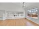 Bright living room with hardwood floors, high ceilings, stylish lighting, and lots of natural light at 5051 Yates Cir, Broomfield, CO 80020