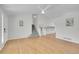 Bright living room features hardwood floors, vaulted ceilings, and staircase to the second floor at 5051 Yates Cir, Broomfield, CO 80020