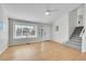 This welcoming living room boasts gleaming hardwood floors and a large window at 5051 Yates Cir, Broomfield, CO 80020