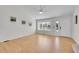 Open-concept living room with light wood floors, plenty of natural light, and modern decor at 5051 Yates Cir, Broomfield, CO 80020