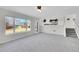 Bright and airy living area with a fireplace and view to the yard at 5051 Yates Cir, Broomfield, CO 80020