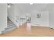 Bright and airy living room with hardwood floors and staircase leading to upper level at 5051 Yates Cir, Broomfield, CO 80020