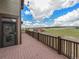 Spacious wooden deck with views of a large field and outbuilding at 1660 Prominence Cir, Elizabeth, CO 80107