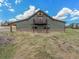 Exterior of house with stone base, balcony, and second-story entrance at 1660 Prominence Cir, Elizabeth, CO 80107