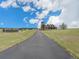 Beautiful house situated on a sprawling green lot with a long driveway leading to the residence at 1660 Prominence Cir, Elizabeth, CO 80107