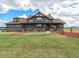 Charming two-story home with landscaped yard, mature trees, and covered porch at 1660 Prominence Cir, Elizabeth, CO 80107