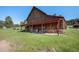 Rustic barn with a covered outdoor area, showcasing its spacious layout and country charm at 6880 Kilimanjaro Dr, Evergreen, CO 80439