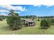 Charming home with a covered porch, nestled on a sprawling lot with mature trees and mountain views at 6880 Kilimanjaro Dr, Evergreen, CO 80439