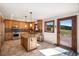 Well-appointed kitchen featuring a center island, stainless appliances and a walkout to the deck at 6880 Kilimanjaro Dr, Evergreen, CO 80439