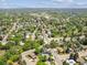 Expansive aerial view of a community with tree-lined streets, and neighborhood parks near local schools at 1333 W Peakview Ave, Littleton, CO 80120