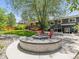Spacious backyard featuring grass, a stone firepit, and the rear of the home at 1333 W Peakview Ave, Littleton, CO 80120