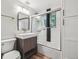 Modern bathroom features a sleek vanity, frameless shower, and elegant fixtures at 1333 W Peakview Ave, Littleton, CO 80120