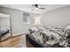 Stylish bedroom features light wood floors, large mirror, and a comfortable bed at 1333 W Peakview Ave, Littleton, CO 80120