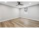 This bright bedroom features light wood floors, a window, and a neutral color palette at 1333 W Peakview Ave, Littleton, CO 80120
